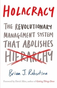 Holacracy : The Revolutionary Management System that Abolishes Hierarchy